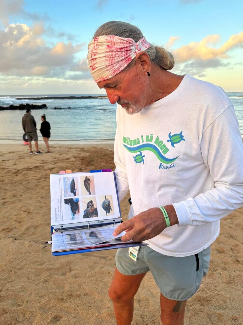 An old man reading a book at beach